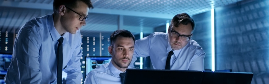 business professional men looking at computer monitor in IT office room