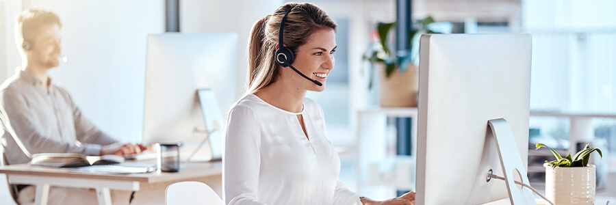 help desk employees with headsets talking to customers